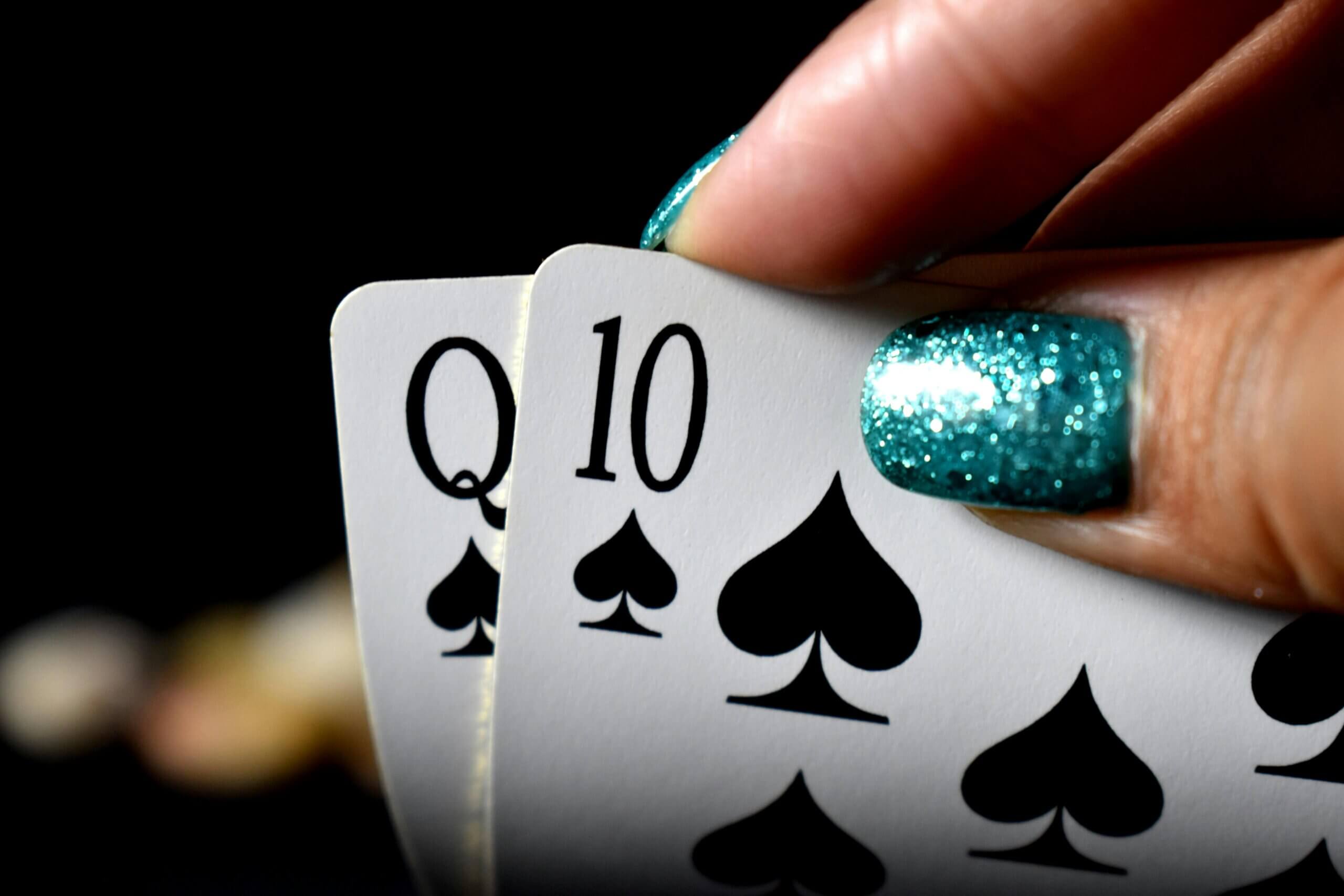 pexels-clifford-photos-1144122-2444580 Queen and Ten of spades during a poker game