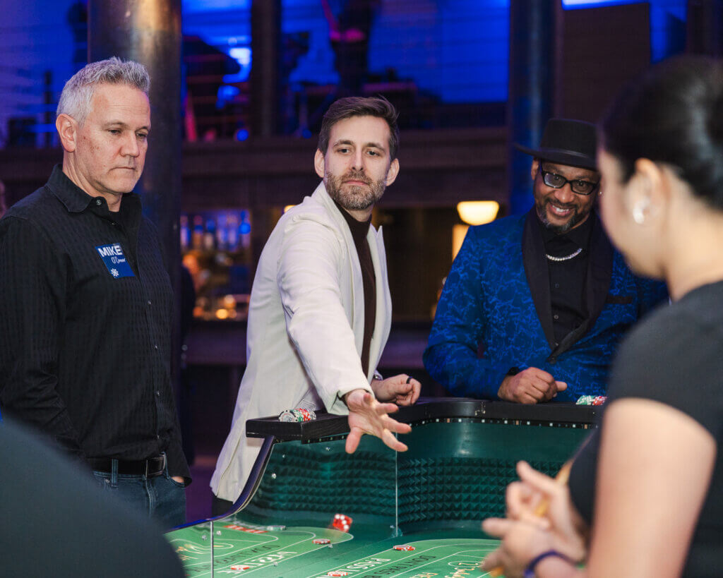 Guests playing craps at a Casino Night in Milwaukee